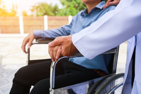 Physical therapist Disabled wheelchair with professional care.conceptの写真素材