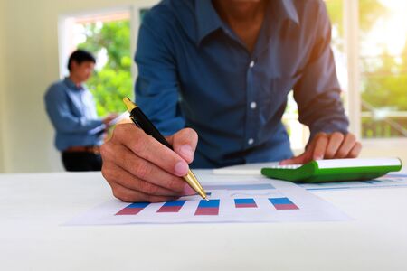 businessman team is analyzing the cost of housing projects to live with lifestyle.business concept, soft focus, vintage toneの写真素材