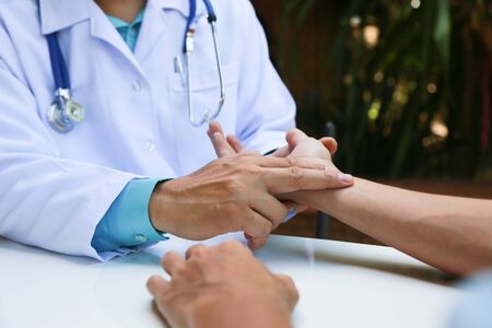 Doctors are encouraging patientson doctors table in hospital. to have the power to fight off illness.の写真素材