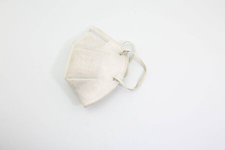 Dust mask and Covid 19 protection, placed on a white backgroundの写真素材