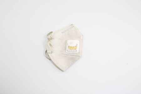 Dust mask and Covid 19 protection, placed on a white backgroundの写真素材