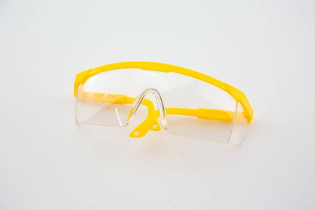 Yellow plastic medical eyes on a white backgroundの写真素材