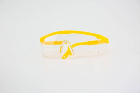 Yellow plastic medical eyes on a white backgroundの写真素材
