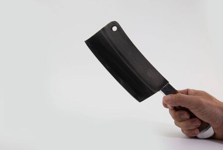 Close-Up Of Meat Cleaver Against White Backgroundの写真素材