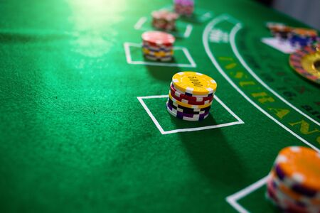 Casino equipment placed on the green floor for risky gambling for the people who want to get rich.の写真素材