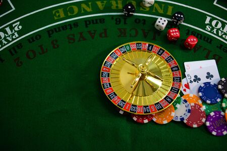 Casino equipment placed on the green floor for risky gambling for the people who want to get rich.の写真素材