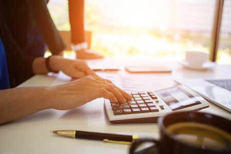 business team is calculating tax rates for the government.