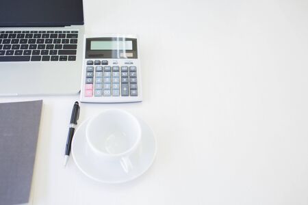 Accounting equipment is placed on the desk in the house to reduce meeting people according to work-at-home measures.の写真素材