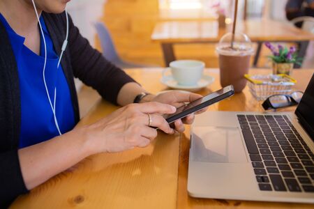 businesswoman hands searching for data on Notebook with analyzing charts at his workplace.conceptの写真素材