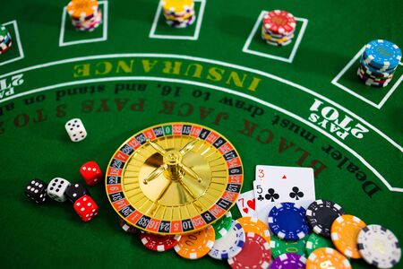 Casino equipment placed on the green floor for risky gambling for the people who want to get rich.の写真素材