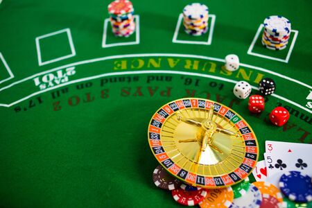 Casino equipment placed on the green floor for risky gambling for the people who want to get rich.の写真素材