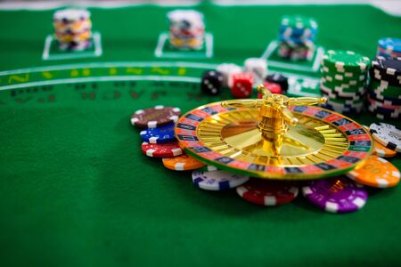 Casino equipment placed on the green floor for risky gambling for the people who want to get rich.の写真素材