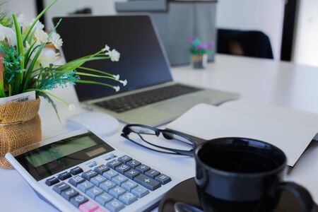 business team hands searching for data on mobile phone  with analyzing charts at his workplace.の写真素材