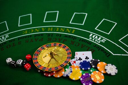 Casino equipment placed on the green floor for risky gambling for the people who want to get rich.の写真素材