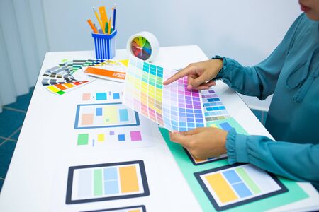 designers are testing the mobile phone screen to suit their usage.UX UI and Programming development conceptの写真素材