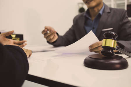 team of attorneys convened to prepare evidence for the case of the client in court.の写真素材
