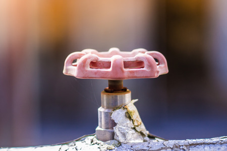 Rusty gate valve of water heater pipe, Texture of rust with blur background.の写真素材
