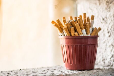 Close-up many cigarettes on the ashtrayの写真素材