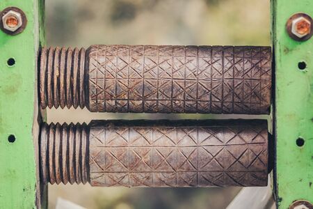 Old rusty axle shaft of sugarcane juice machine manualの写真素材