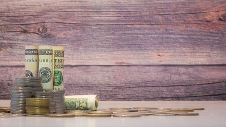 Stacks of coins on the white table, Money saving concept with copy specsの写真素材