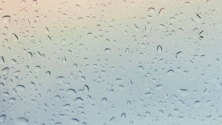 Water drops on glass windows of car with copy space.の写真素材