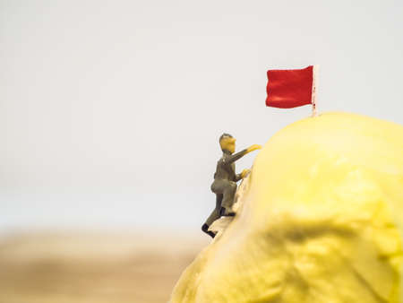 Miniature people Close up workers work on durian isolated on white background (food concept)の写真素材