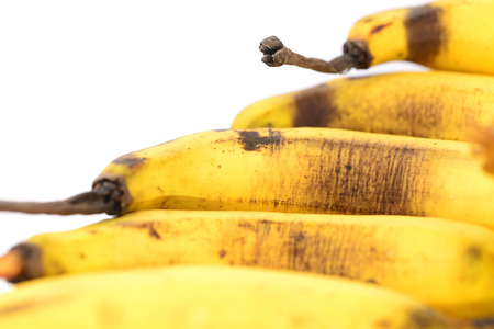 banana bunch on the turn in a market stallの写真素材