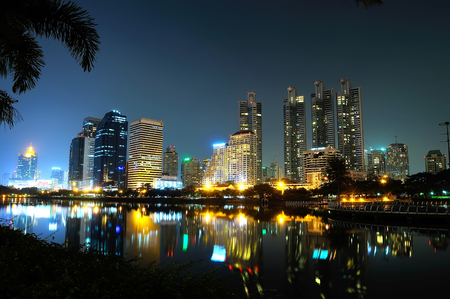 mirror water with night city Bangkok Thailandの写真素材