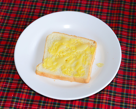 slices of wheaten bread spreaded with butter