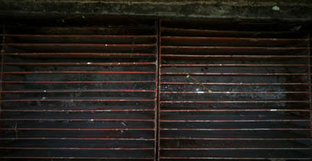 brown metal grate to drain water into the drainage grooveの写真素材