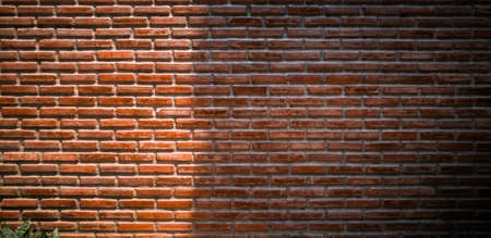 panoramic red brick wall with beauty lighting, old red brick wall in sunlight with beauty pattern and textureの写真素材