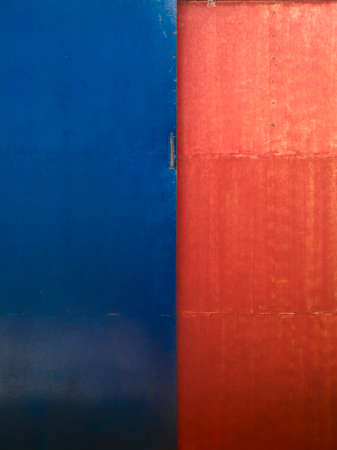 abstract background of blue and red metal plate, metal door with blue and red paintの写真素材