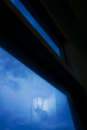 lamp reflected on window glass when dawn, abstract background to conveys a new beginningの写真素材
