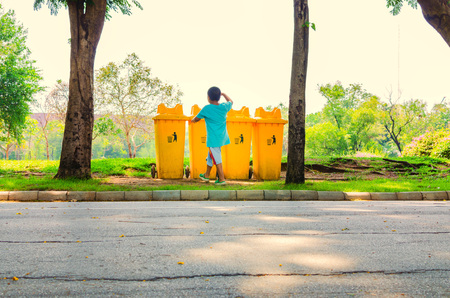 yellow bin in the parkの写真素材