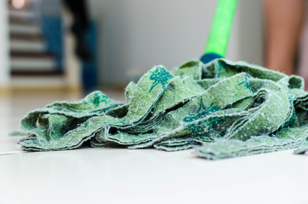 Woman with mop cleaning  floorの写真素材