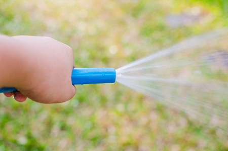 Watering lawn grassの写真素材