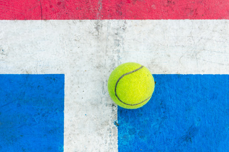 Tennis ball on concrete floor.Top view old concrete tennis courtの写真素材