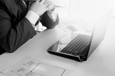 Thinking young business man work in laptopの写真素材