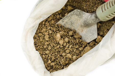 Dry cow dung in bag,Dry manure on white backgroundの写真素材