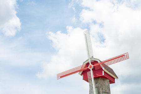 Dutch windmil on cloud and blue sky background. の写真素材