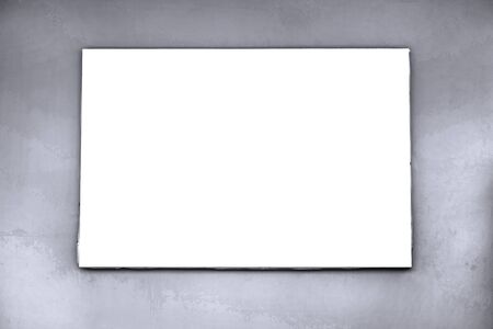 Blank billboard mockup with white screen on cement wall at city street. Copy space banner for advertisement background. Outdoor frame template poster media Ads display.の写真素材