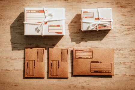 Pile of letters and box parcel. post office concept. top view and flat lay background.の写真素材