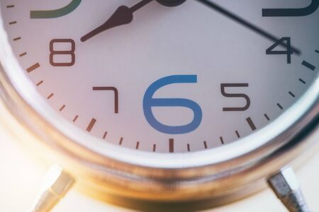 Close up alarm clock at sunlight backgroundの写真素材