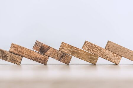 Business loss and folling  concept with block wooden domino effect.の写真素材
