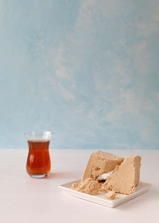 Peanut halva with tea in a Turkish glassの写真素材