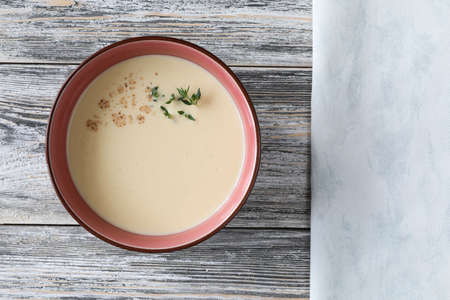 Traditional Italian soup of chicken soup, egg yolks, and wine with copy space - top view