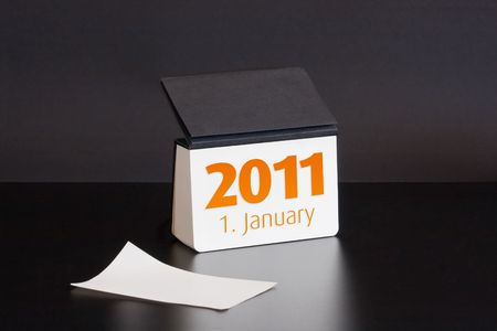 Black notebook 2011 year calendar. first Januaryの写真素材