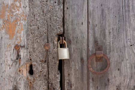 Old wooden planks door locked with rusty nailsの写真素材
