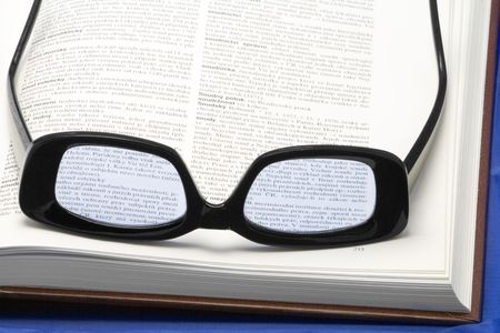 glasses (eyewear) on a book - close-upの写真素材