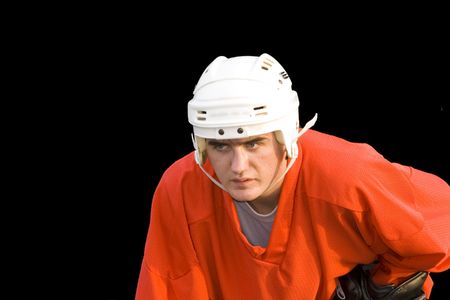 a young hockeyball player on the black backgroundの写真素材